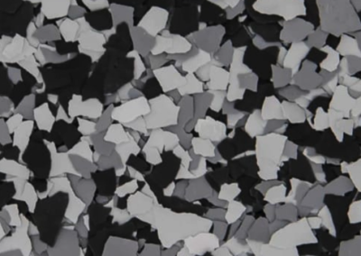 This image shows a flake epoxy called Glacier which is composed of light and dark colored flakes.