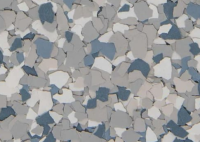 This image shows a flake epoxy called tidal wave which is composed of light and medium colored flakes.