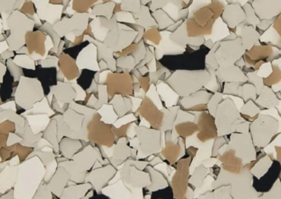 This image shows a flake epoxy called Shoreline which is composed of light and dark colored flakes.