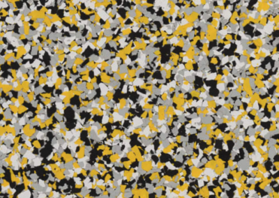 This image shows a flake epoxy called Yellow jacket which is composed of light and dark colored flakes.
